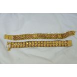 Two 22ct gold Chinese bracelets. 54g