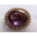 Victorian oval amethyst brooch with pearl surround set in gold