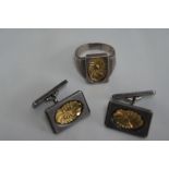 Pair of Georg Jensen silver cufflinks and matching ring with decoration of gold metal flower to