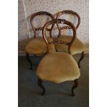 Set of four Victorian carved balloon back dining chairs plus two similar