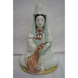 Late 19thC Oriental figure holding a scroll. Ht 10.5 ins.