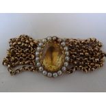 9ct gold four strand link bracelet with oval citrine and pearl surround to clasp