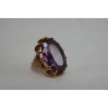 Continental large oval cut amethyst ring in substantial twelve claw gold setting. Size I. Stone 26 x