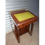 A Victorian style rosewood Davenport with galleried top, eight drawers (four false), pen drawer on