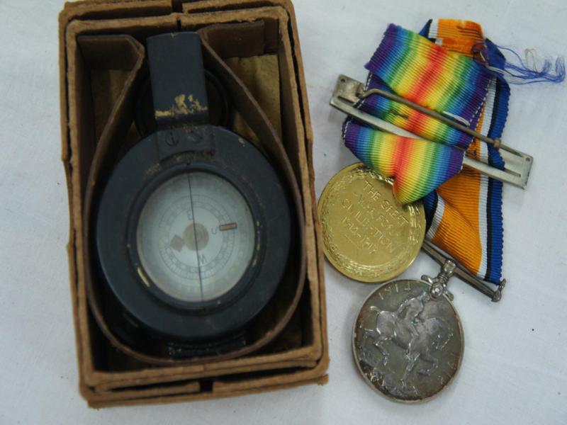 T.G. Co. Ltd London WWII compass with mother of pearl dial, boxed, together with two WWI medals