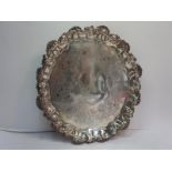 GII silver waiter with shell and scroll border on three paw feet. London 1750, 16ozt.