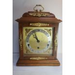 An Elliot figured walnut 8 day lever, Westminster and Whittington chime bracket clock with ormolu
