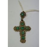 Continental gilt metal cross, inset with rectangular green stones. Ht. 5.5cm