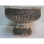 19thC Indian chased silver rose bowl with decoration of village life in cartouches to body on a