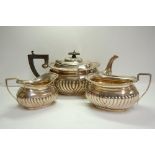 GV silver three-piece half-fluted oval tea service. Birmingham 1910. 35ozt