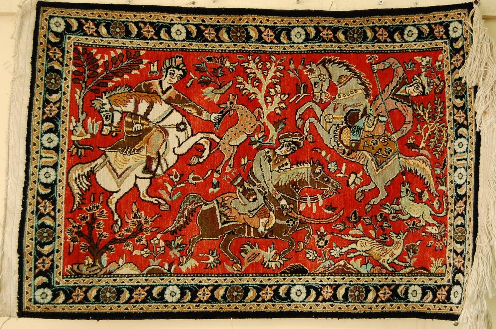 Good Persian silk Qom carpet with decoration of a hunting scene silk on silk 33 x 22ins.