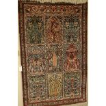 A fine silk garden carpet with nine panels showing flora and fauna, 51 x 33ins.