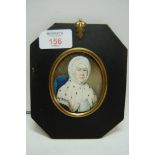 Early 19thC oval portrait miniature on ivory of a woman in a white bonnet and ermine wrap. 2.75 x