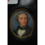 Mid 19thC oval portrait miniature on ivory of a young man in a bow tie, 2 x 1.75ins.