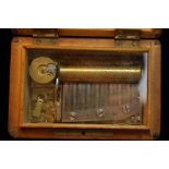 19th / 20thC miniature Swiss music box with inlaid walnut case. key. 4.5 x 3 x 1.75ins.