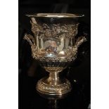 GIV silver wine cooler in the form of a two handled half-fluted urn with decoration of grape vines