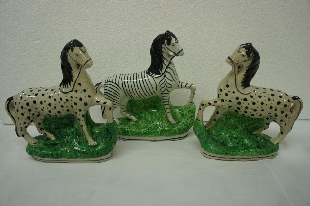 Pair of Staffordshire spotty horses and a zebra height 9 ins.