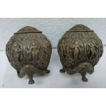 Pair of late 19thC Indian cast silver circular pepper pots with fine figure, floral and mask