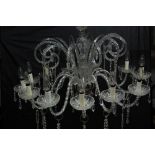 A twenty-four branch Murano clear glass electrolier with barley-twist and reeded decoration to arms.