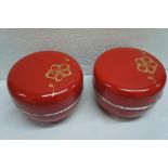 Pair of Chinese red lacquered boxes with silver metal rims. Diameter 4.5 ins.