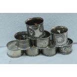 Six silver napkin rings plus two others