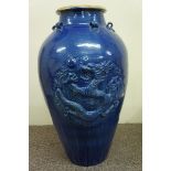 Large Chinese blue glaze stoneware floor vase with dragon decoration in relief. Ht 30 ins.