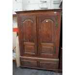 GIII oak carved cupboard with panelled sides and doors, peg construction, brass H hinges, two