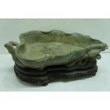 19thC Chinese green soapstone leaf-shaped dish with insect to front on carved hardwood stand. Length