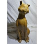 A porcelain cat, seated. Height 18 ins.