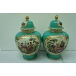 Pair of French porcelain baluster shaped urns with decoration of figure in a garden, height 11 ins.