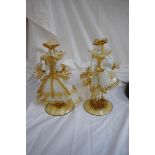 A pair of Murano amber and white glass figures, lady and gentleman, height 10 ins., signed G