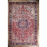 Persian Heriz Carpet, red ground, central medallion, overall floral design, 9 ft. 4 in. x 13 ft. 6