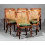 Six Antique Regency-Style Mahogany and Caned Gondola Dining Chairs, 19th c., each with incurvate