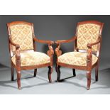 Pair of Louis Philippe Carved Mahogany Armchairs, early 19th c., arched crest rail, foliate carved