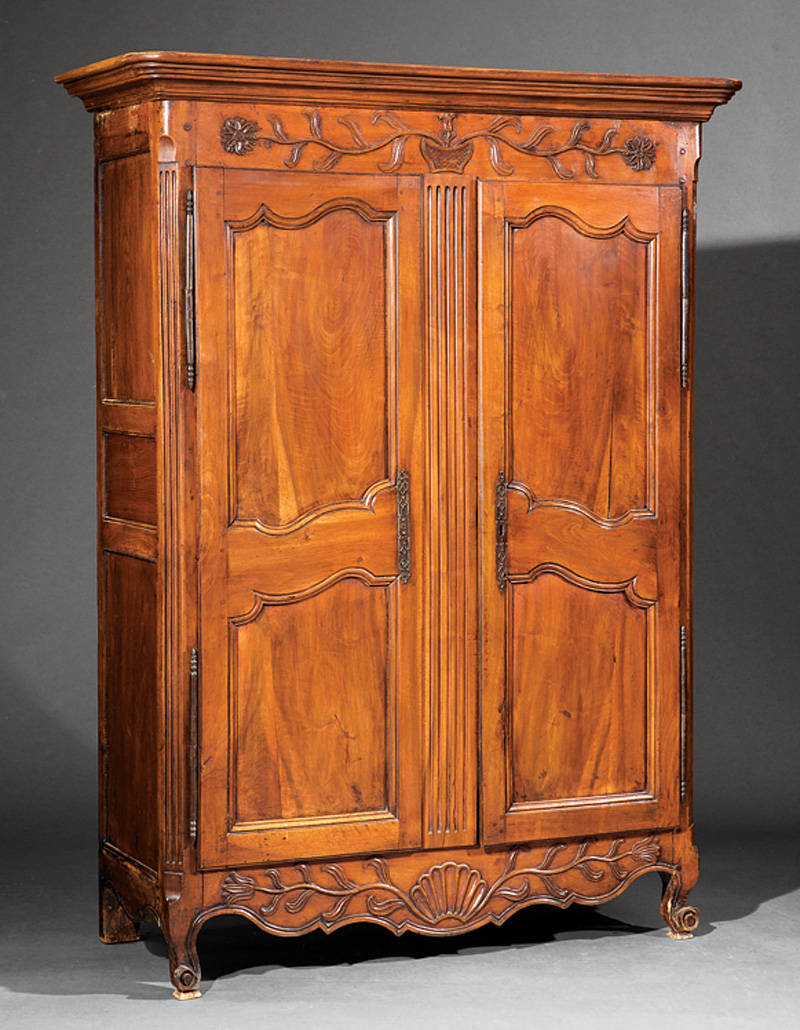 Louis XVI Walnut Armoire, 18th c., molded cornice, basket of flowers frieze, scalloped doors, fitted