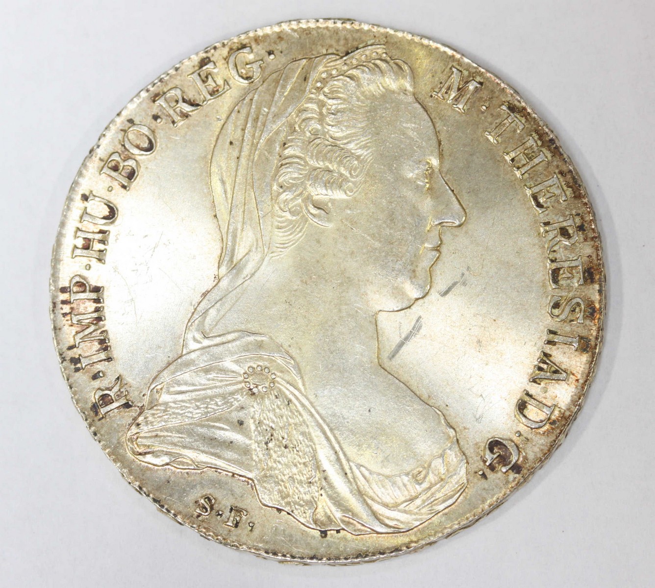 A silver 1780 Maria Theresa Thaler trade coin, inscribed 'BURG CO TYR 1780 X ARCHID AUST DUX' with