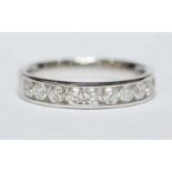 An 18ct white gold and diamond half eternity ring, set with ten brilliant cut diamonds, weighing