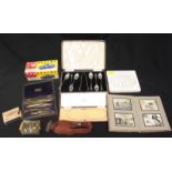 A collection of assorted items including a carved marble tile, a set of draghtsmans tools, an