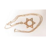 A 9ct gold star of David pendant on an Italian 9ct gold chain. 11.8 grams.