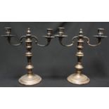 A pair of modern silver two-light candelabra, with knopped and baluster stems and fixed drip pan,