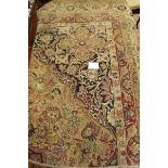A late 19th Century quarter-fragment of a large Kerman hand-knotted carpet, central medallion,