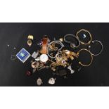 A box of assorted costume jewellery and some small silver items, including a locket and earrings,