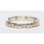 An 18ct gold eternity ring set with nine small diamonds, 1.7 grams