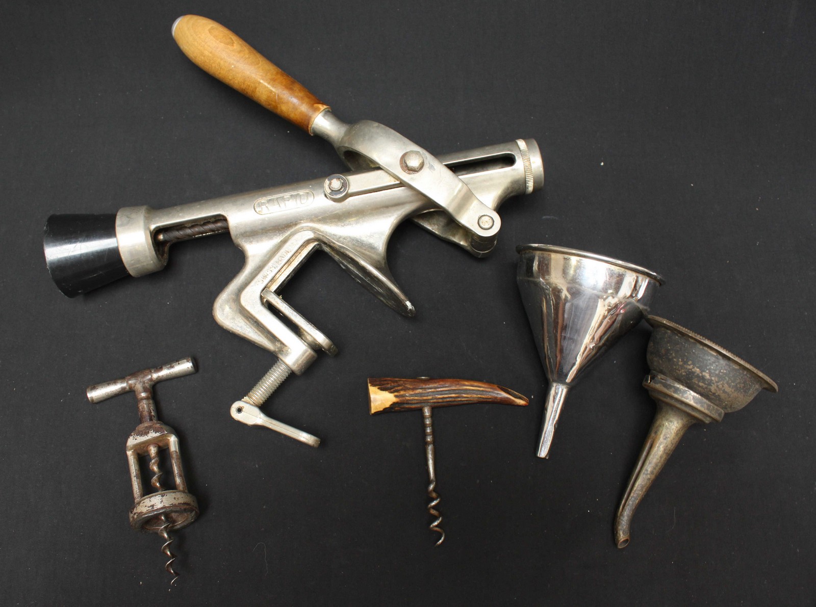 Breweryana. A bar mounted bottle opener, together with two cork screws and two bottle openers.