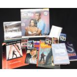 A collection of James Bond ephemera and collectables including modern books and packs of playing