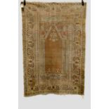 Ghiordes prayer rug, west Anatolia, early 20th century, 5ft. 7in. x 3ft. 10in. 1.70m. x 1.17m.