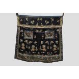 Chinese black silk satin embroidered robe fragments made into a coverlet or altar frontal,