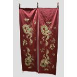 Three Chinese silk embroidered panel fragments, deep pink silk satin, each piece finely