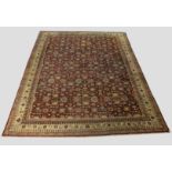 Good Agra red ground carpet, north India, early 20th century, 16ft. 5in. x 12ft. 1in. 4.99m. x 3.