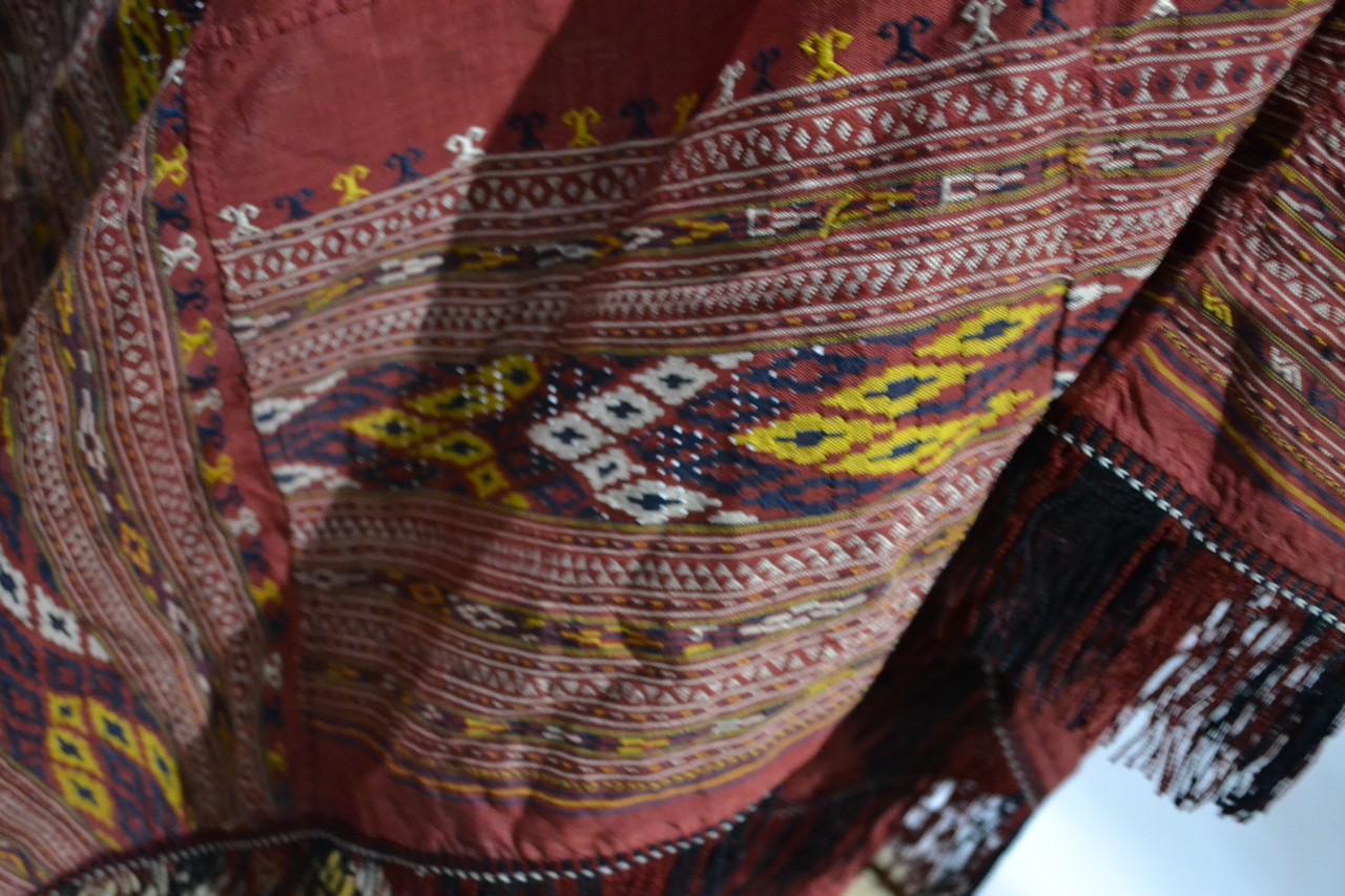 Collection of Turkmen red silk textiles, embroidered and with weft float brocade details, first half - Image 10 of 20